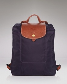 A timeless and durable nod to French style, Longchamp' nylon backpack stows any essentials for the très chic girl on the go. A timeless and durable nod to French style, Longchamp' nylon backpack stows any essentials for the très chic girl on the go.