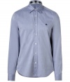 Casual and cool with its classic styling and super soft cotton, Burberry Brits light denim-colored button-down is a timeless choice for all 4 seasons - Cutaway collar, long sleeves, buttoned cuffs, button-down front, navy embroidered logo at chest, shirttail hemline - Classic straight silhouette - Wear with chinos and bright leather loafers