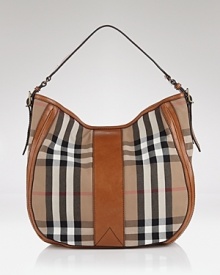 Iconic as it is eye-catching, Burberry's signature check hobo is a stylishly sound investment. The classic carryall elevates daily looks, calling for a trench coat and polished pumps. Iconic as it is eye-catching, Burberry's signature check hobo is a stylishly sound investment. The classic carryall elevates daily looks, calling for a trench coat and polished pumps.