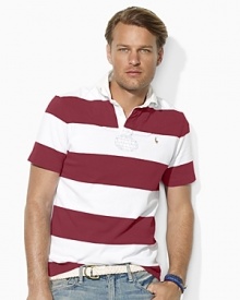 A short-sleeved rugby shirt is cut for a comfortable, relaxed fit from rustic utility cotton jersey with bold stripes for masculine polish. A short-sleeved rugby shirt is cut for a comfortable, relaxed fit from rustic utility cotton jersey with bold stripes for masculine polish.