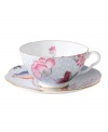 Delight in the tradition of English tea with the Cuckoo teacup and saucer set, featuring Wedgwood bone china adorned with gold bands, fanciful birds and vintage blooms. With scalloped detail.