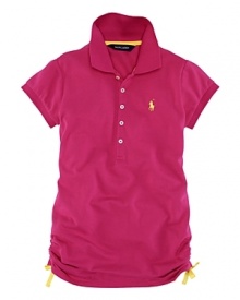 A classic short-sleeved polo shirt is updated with vibrant colors and ruching at the sides. A classic short-sleeved polo shirt is updated with vibrant colors and ruching at the sides.
