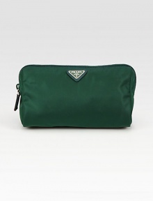 This soft, triangular-shaped design in signature nylon has a front logo hardware plate and a leather zipper pull. Zipper closure Inside zipper pocket Nylon lining 8W X 5H X 3½D Made in Italy This soft, triangular-shaped design in signature nylon has a front logo hardware plate and a leather zipper pull. Zipper closure Inside zipper pocket Nylon lining 8W X 5H X 3½D Made in Italy