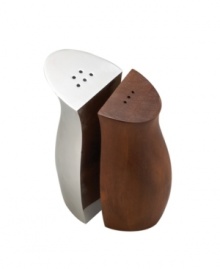 Get balanced flavor and style with Cradle salt and pepper shakers. Half Nambe metal, half acacia wood, this beautifully designed set brings casual tables together in perfect modern harmony. Get balanced flavor and style with Cradle salt and pepper shakers. Half Nambe metal, half acacia wood, this beautifully designed set brings casual tables together in perfect modern harmony.