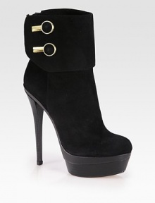 Shiny goldtone buttons pump up this sexy ankle boot, finished with an edgy back zip. Stacked heel, 6 (150mm)Stacked platform, 1¾ (45mm)Compares to a 4¼ heel (110mm)Suede upper with metal buttonsBack zipLeather lining and solePadded insoleImported