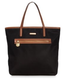 Practical and poised for work or play, this roomy tote from MICHAEL Michael Kors is an everyday essential. Made from durable nylon with sturdy straps and plenty of pockets, it's ideally sized for shopping trips or jaunts to the gym. Practical and poised for work or play, this roomy tote from MICHAEL Michael Kors is an everyday essential. Made from durable nylon with sturdy straps and plenty of pockets, it's ideally sized for shopping trips or jaunts to the gym.
