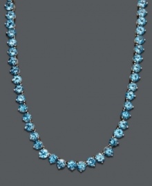 Cool down your look in icy blue hues. This vibrant necklace features a seamless row of round-cut blue topaz (45 ct. t.w.) set in sterling silver. Approximate length: 17 inches. Cool down your look in icy blue hues. This vibrant necklace features a seamless row of round-cut blue topaz (45 ct. t.w.) set in sterling silver. Approximate length: 17 inches.
