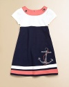 Set sail for this gorgeous, sailor-inspired frock in a classic a-line silhouette with anchor appliqué.Boatneck with button detailShort sleevesBack buttonsA-lineStriped hemCottonMachine washImported Please note: Number of buttons may vary depending on size ordered. 