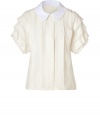 With its sweet round collar and playful pleating, Marc by Marc Jacobs blouse is a feminine staple perfect for wearing alone, or layered under cool modern knits - Rounded white spread collar, hidden button-down front, short sleeves, elasticized cuffs, pleated throughout - Softly tailored fit - Wear with patterned pants and wedges, or with contemporary knits and timeless outerwear