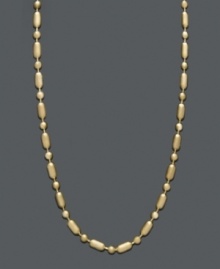 A delicate chain with subtle flair. This 14k gold necklace chain features a cylindrical and beaded dot dash design with a spring ring clasp. Approximate length: 20 inches. A delicate chain with subtle flair. This 14k gold necklace chain features a cylindrical and beaded dot dash design with a spring ring clasp. Approximate length: 20 inches.