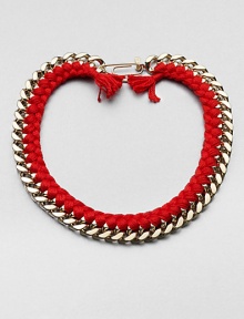 A chunky chain, with the look of a vintage ID bracelet, is modernized with bright red braiding with tassels and a fun paper-clip clasp.GoldplatedCottonLength, about 16.5Spring ring paper clip claspMade in France A chunky chain, with the look of a vintage ID bracelet, is modernized with bright red braiding with tassels and a fun paper-clip clasp.GoldplatedCottonLength, about 16.5Spring ring paper clip claspMade in France
