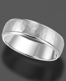 A timeless ring in 14k white gold, featuring engraving and a subtle, mottled texture. A timeless ring in 14k white gold, featuring engraving and a subtle, mottled texture.