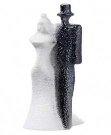 Bride and groom look equally stunning in this Kosta Boda sculpture, strutting down the aisle in handcrafted glass. A textured surface is created with heated glass powder for added interest and that unmistakable wedding day glow. Designed by Kjell Engman. Bride and groom look equally stunning in this Kosta Boda sculpture, strutting down the aisle in handcrafted glass. A textured surface is created with heated glass powder for added interest and that unmistakable wedding day glow. Designed by Kjell Engman.