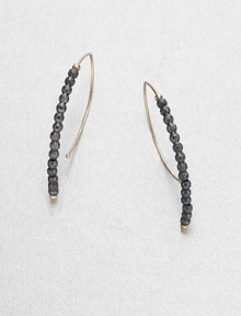 Elegantly simple arc-shaped hoops are strung with faceted beads of blackened sterling silver, capped with tiny beads of 14k gold.14k yellow gold and oxidized sterling silverLength, about 1.25PiercedMade in USA Elegantly simple arc-shaped hoops are strung with faceted beads of blackened sterling silver, capped with tiny beads of 14k gold.14k yellow gold and oxidized sterling silverLength, about 1.25PiercedMade in USA