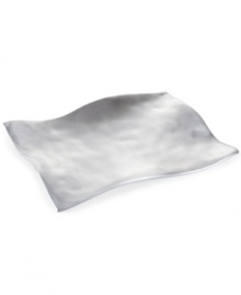Handcrafted in aluminum alloy with an organic shape and brushed finish, the rectangular Dimension platter from Donna Karan Lenox lends a serene, dreamy quality to modern tables.