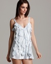 Display a hint of romance in the bedroom with this ruffled chemise with rosette detail.