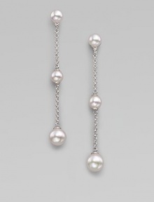 Graceful chains of sterling silver have round white pearls at the top, the bottom and in the middle as they dangle delicately. 6mm and 8mm white round organic man-made pearls Sterling silver Drop, about 2¾ Post back Made in Spain