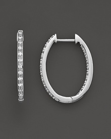Elegant and simple oval inside-out hoop earrings crafted in 14k white gold and diamonds. Elegant and simple oval inside-out hoop earrings crafted in 14k white gold and diamonds.