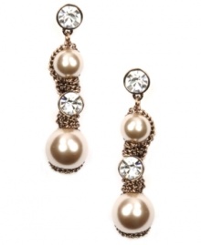 Put on the finishing touches. Givenchy's special occasion earrings shimmer with the addition of glass pearls and crystals. Set in unique brown gold-plated mixed metal. Approximate drop: 2-1/4 inches.