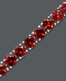 Vibrantly versatile. Ruby red stones of round-cut garnet (20 ct. t.w.) make a mark in your corporate or casual lifestyle. Bracelet crafted in sterling silver. Approximate length: 7 inches. Vibrantly versatile. Ruby red stones of round-cut garnet (20 ct. t.w.) make a mark in your corporate or casual lifestyle. Bracelet crafted in sterling silver. Approximate length: 7 inches.