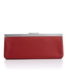 Calvin Klein gives a modern interpretation to the classic clutch. Available in bright crimson, glossy silver or cracked black or coordinate with any elegant evening look. Calvin Klein gives a modern interpretation to the classic clutch. Available in bright crimson, glossy silver or cracked black or coordinate with any elegant evening look.