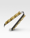 A modern statement in style combines organic elements with a sleek, stainless steel silhouette. Each bamboo accent is hand-gilded with 24k gold and soldered with sterling silver. From the Bambou CollectionStainless steel with 24k goldplate6 diam.Hand washImported