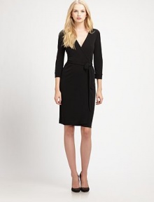 Shape-flattering rayon wrap with v-neckline. Three-quarter cuffed sleeves Self tie at waist About 25 from natural waist Dry clean Made in USAOUR FIT MODEL RECOMMENDS ordering true size. Shape-flattering rayon wrap with v-neckline. Three-quarter cuffed sleeves Self tie at waist About 25 from natural waist Dry clean Made in USAOUR FIT MODEL RECOMMENDS ordering true size.