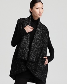 This Donna Karan New York tweed vest is the finishing touch to your fall capsule collection. A draped collar and piped seams are the perfect accents to the chic style, effortless over everything from a turtleneck sweater to a little black dress.