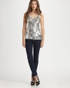 Glittering sequins swirl over the mesh front of this scoopneck tank for a look that's simply-dazzling.ScoopneckWide strapsSequined mesh frontAbout 27 from shoulder to hemFront: 50% viscose/45% rayon/5% lycraBack: rayonDry cleanImportedModel shown is 5'9 (175cm) wearing US size Small.