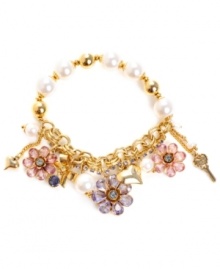 Looking feminine has never felt so effortless. Betsey Johnson's chic stretch bracelet combines sweet flower and heart charms with sparkling purple, blue and pink crystals and glass pearl accents. Set in antique gold-plated mixed metal. Approximate length: 7-1/2 inches. Looking feminine has never felt so effortless. Betsey Johnson's chic stretch bracelet combines sweet flower and heart charms with sparkling purple, blue and pink crystals and glass pearl accents. Set in antique gold-plated mixed metal. Approximate length: 7-1/2 inches.