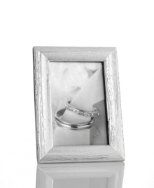 Martha Stewart Collection brings a natural look to lustrous silver plate with the sophisticated Silver Grain picture frame. With velvet backing. Martha Stewart Collection brings a natural look to lustrous silver plate with the sophisticated Silver Grain picture frame. With velvet backing.
