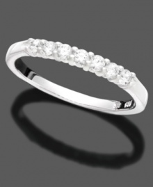 This slender anniversary ring captures love and elegance with seven round-cut diamonds (1/4 ct. t.w.) in 14k white gold. This slender anniversary ring captures love and elegance with seven round-cut diamonds (1/4 ct. t.w.) in 14k white gold.