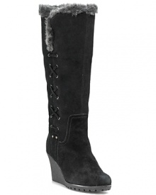 Wrap yourself in autumn's lushest textures. These tall suede wedge boots are trimmed in soft fur and finished with rugged stitches. by Kelsi Dagger. Wrap yourself in autumn's lushest textures. These tall suede wedge boots are trimmed in soft fur and finished with rugged stitches. by Kelsi Dagger.