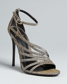 B Brian Atwood gets strap-happy-to great effect-in these distinctive dress sandals. This timeless yet trend-right design works with your entire wardrobe, thanks to metallic material that flashes both gold and silver.