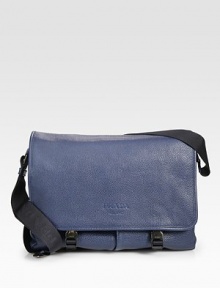 Sporty, yet sophisticated, rendered in grained calfskin leather.Flap, buckle closureAdjustable shoulder strapExterior, interior pocketsFully lined14¼W x 10½H x 5¼DMade in Italy Sporty, yet sophisticated, rendered in grained calfskin leather.Flap, buckle closureAdjustable shoulder strapExterior, interior pocketsFully lined14¼W x 10½H x 5¼DMade in Italy
