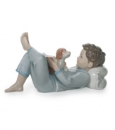 Lladro tells the charming tale of a boy and his dog with this artfully glazed porcelain figurine. Sweet for a child's bedroom.