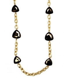 Long story. AK Anne Klein's chic long chain necklace is adorned with bronze-hued plastic beads. Crafted in gold tone mixed metal, it's a fashionable addition for your fall wardrobe. Approximate length: 36 inches.