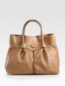 A well-crafted, supple leather style with contrast edges and feminine pleated details.Double top handles, 6 dropMagnetic snap closureOne inside zip pocketTwo inside open pocketsSatin lining12W X 11H X 5DImported