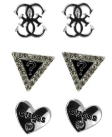 Triple up on style featuring everyone's favorite brand. GUESS's three pair stud earrings set features the quattro G, the signature triangle logo, and logo-imprinted hearts. Crafted in silver tone mixed metal with jet epoxy and crystal accents. Approximate diameter: 1/4 inch each. Triple up on style featuring everyone's favorite brand. GUESS's three pair stud earrings set features the quattro G, the signature triangle logo, and logo-imprinted hearts. Crafted in silver tone mixed metal with jet epoxy and crystal accents. Approximate diameter: 1/4 inch each.