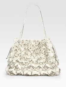 Gorgeous leather rosettes adorn this roomy design for a feminine look.Braided double top handles, 11 dropTop snap closureOne inside zip pocketTwo inside open pocketsLeather/canvas lining15¼W X 11¾H X 4¾DMade in Italy Gorgeous leather rosettes adorn this roomy design for a feminine look.Braided double top handles, 11 dropTop snap closureOne inside zip pocketTwo inside open pocketsLeather/canvas lining15¼W X 11¾H X 4¾DMade in Italy