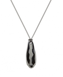 Jet set: Wherever you're headed next, don't forget to bring along Swarovski's minimally elegant jet crystal drop pendant necklace. It's versatile enough to wear with a variety of outfits, whether casual or dressy. Made in ruthenium tone mixed metal. Approximate length: 15 inches. Approximate drop: 1-1/8 inches.