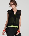 Infuse bold color into your wardrobe with this sporty-chic DIANE von FURSTENBERG top--a layered silhouette with lime green at the base and black mesh above. Boasting a high/low hem, this resort-ready look brightens up the most minimalist staples, making your basics anything but boring.