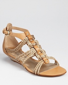 Boho braids wrap around these Belle by Sigerson Morrison sandals, gleaming in gold leather subdued by tan trim. A mini wedge gives an ever-so-subtle lift. Boho braids wrap around these Belle by Sigerson Morrison sandals, gleaming in gold leather subdued by tan trim. A mini wedge gives an ever-so-subtle lift.