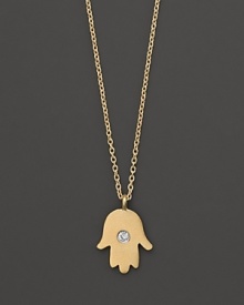 A diamond adds sparkle to a 14K. yellow gold hamsa necklace by Meira T.