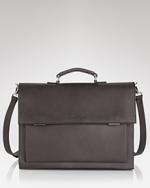 This exceptionally innovative brief from the always masterful Salvatore Ferragamo will exceed your expectations. Three interior gussets expand for additional storage space, providing 4 organizational compartments. Plus, the gussets double as zip pockets for even more storage capacity. The brief quickly converts to a backpack, perfect for traveling, especially when you're on a tight schedule or between connections. Crafted in premium Italian leather with a contrast plum interior, this brief offers the height of luxury and design. This exceptionally innovative brief from the always masterful Salvatore Ferragamo will exceed your expectations. Three interior gussets expand for additional storage space, providing 4 organizational compartments. Plus, the gussets double as zip pockets for even more storage capacity. The brief quickly converts to a backpack, perfect for traveling, especially when you're on a tight schedule or between connections. Crafted in premium Italian leather with a contrast plum interior, this brief offers the height of luxury and design.