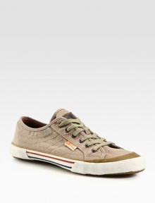 Sporty lace-up silhouette enlivened by a natural canvas upper with logo detail and striped rubber sole.Textile/leather upperPadded insoleRubber soleImported Sporty lace-up silhouette enlivened by a natural canvas upper with logo detail and striped rubber sole.Textile/leather upperPadded insoleRubber soleImported