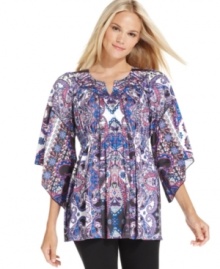 A vibrant print and statement silhouette make this top from Style&co. eye-catching.