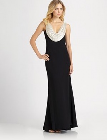 A shimmering beaded cowl neckline dresses up this elegant floor-length silhoeutte.Front and back beaded cowlSleevelessFlared skirtSilk liningAbout 47 from natural waistRayon/silkDry cleanImportedModel shown is 5'10½ (179cm) wearing US size 4. A shimmering beaded cowl neckline dresses up this elegant floor-length silhoeutte.Front and back beaded cowlSleevelessFlared skirtSilk liningAbout 47 from natural waistRayon/silkDry cleanImportedModel shown is 5'10½ (179cm) wearing US size 4.