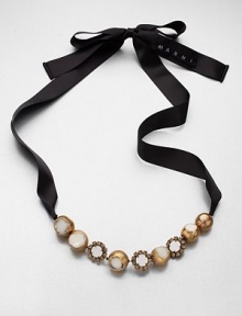 A unique piece on satin ribbon that features sparkling glass stones and glossy, resin accented metal ball links. GlassResinPolyesterBrassLength, about 19.7Tie closureImported A unique piece on satin ribbon that features sparkling glass stones and glossy, resin accented metal ball links. GlassResinPolyesterBrassLength, about 19.7Tie closureImported