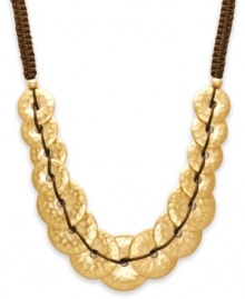 Beautifully bohemian. Featuring a unique braided cord design, this Lauren by Ralph Lauren necklace is embellished with a hammered disk motif. Crafted in gold tone mixed metal, it includes a toggle closure. Approximate length: 18 inches.